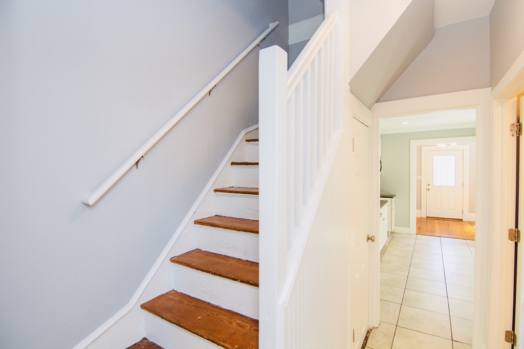 44 Cottage Street Lynn, MA 01905 - Photo 21 of 37 a view of entryway and hall with wooden floor