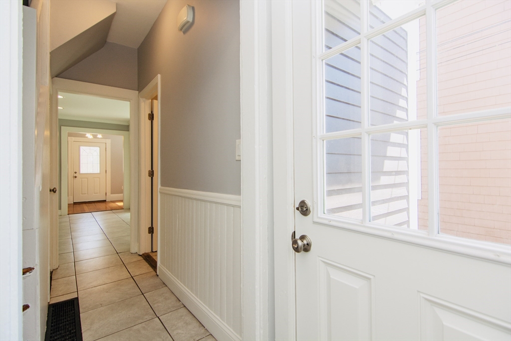 44 Cottage Street Lynn, MA 01905 - Photo 36 of 37 a view of a bedroom from a hallway