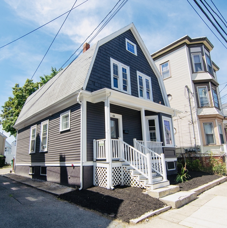 44 Cottage Street Lynn, MA 01905 - Photo 4 of 37 a front view of a house with a garden