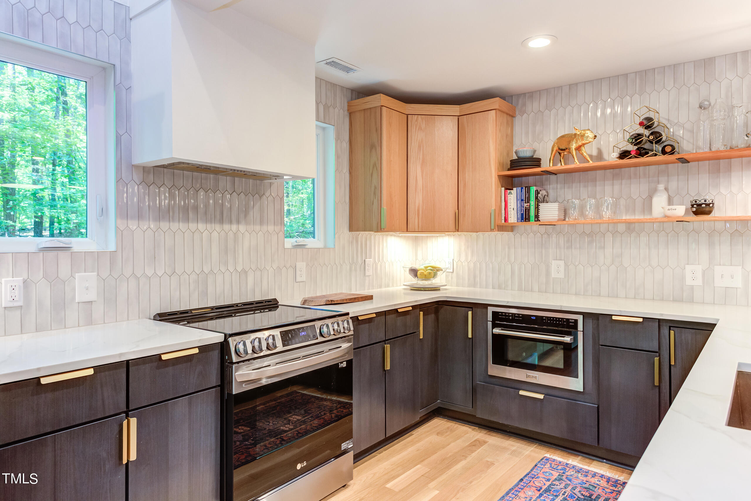 2008 Ridgewood Road Chapel Hill, NC 27516 - Photo 17 of 73 a kitchen with stainless steel appliances granite countertop a stove a sink and a microwave