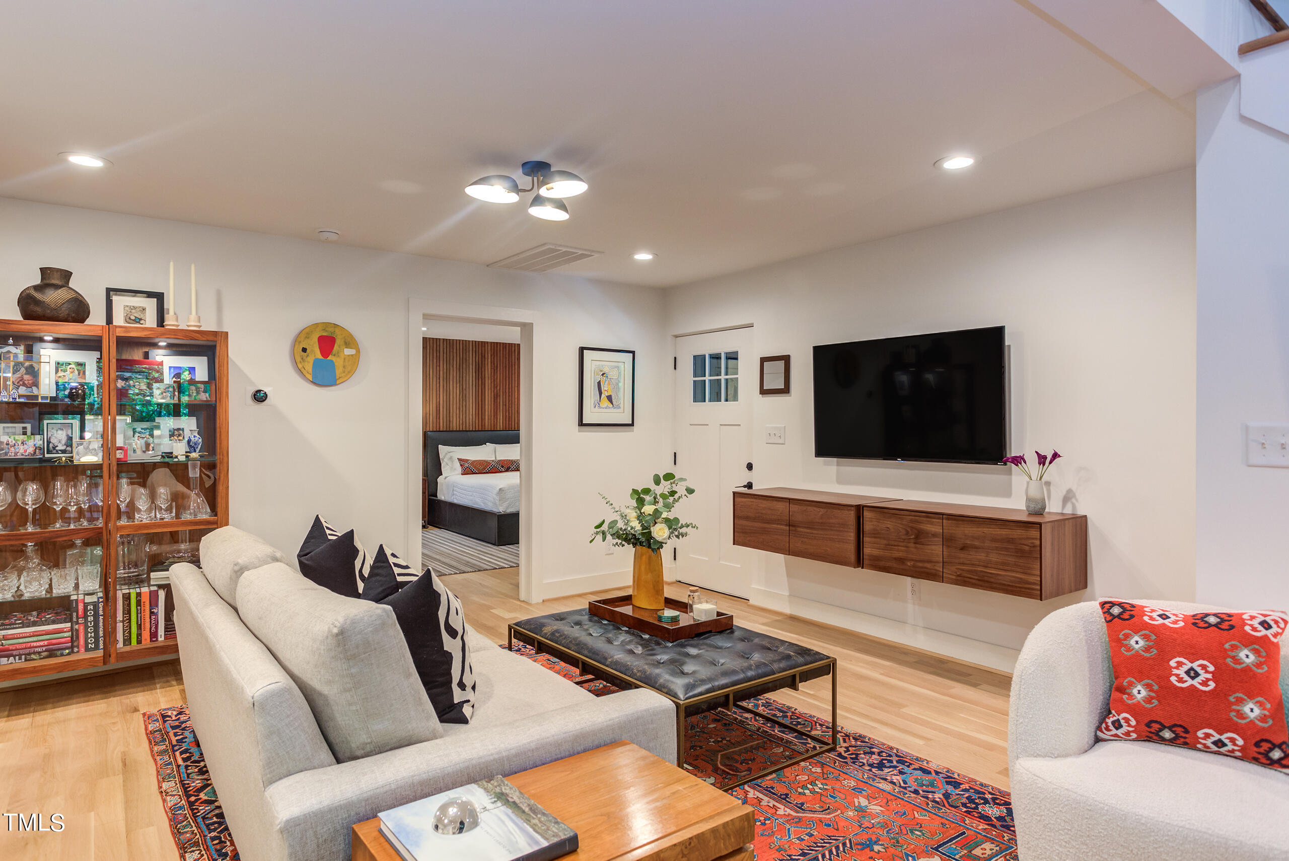 2008 Ridgewood Road Chapel Hill, NC 27516 - Photo 18 of 73 a living room with furniture and a flat screen tv