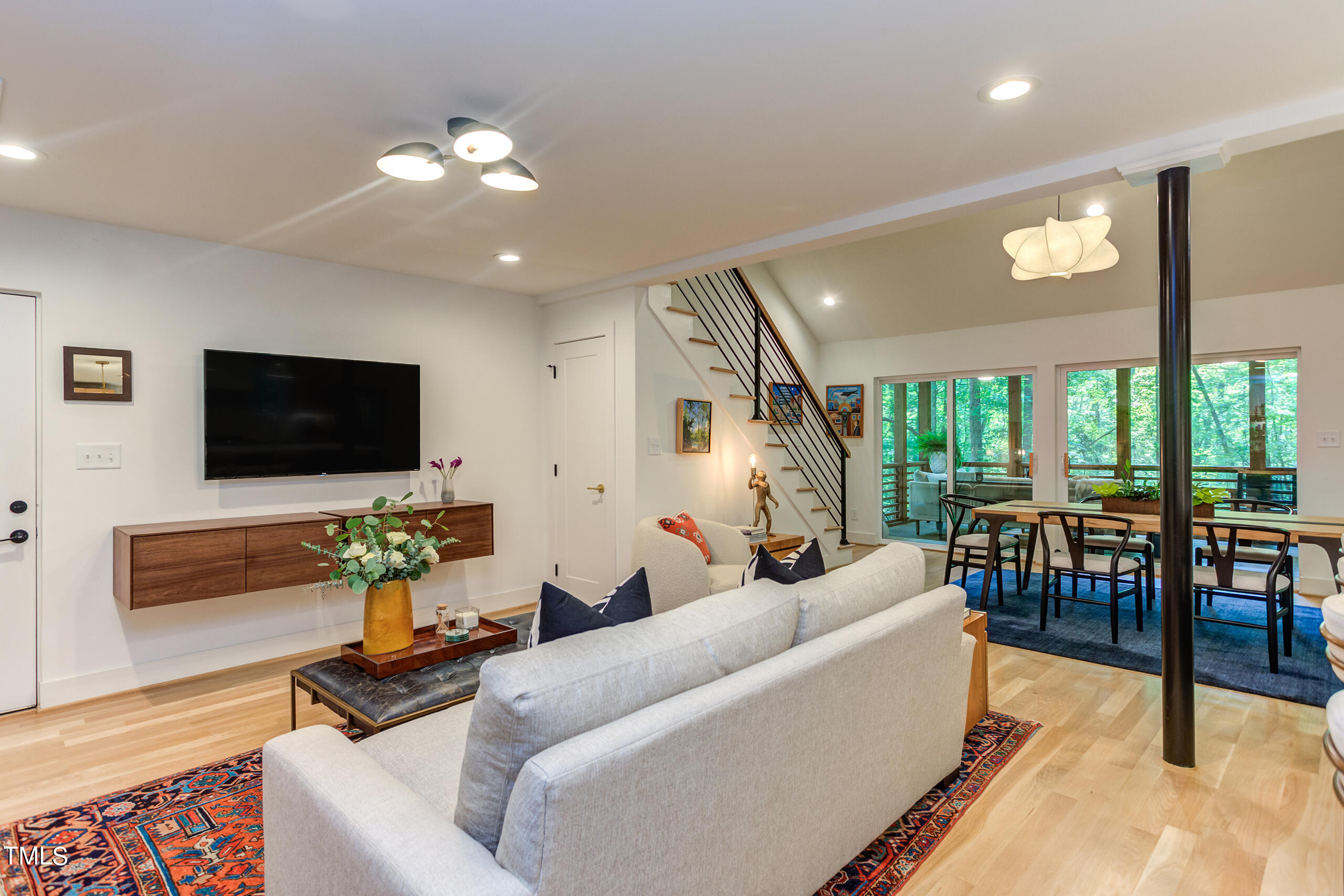 2008 Ridgewood Road Chapel Hill, NC 27516 - Photo 22 of 73 a living room with furniture and a flat screen tv