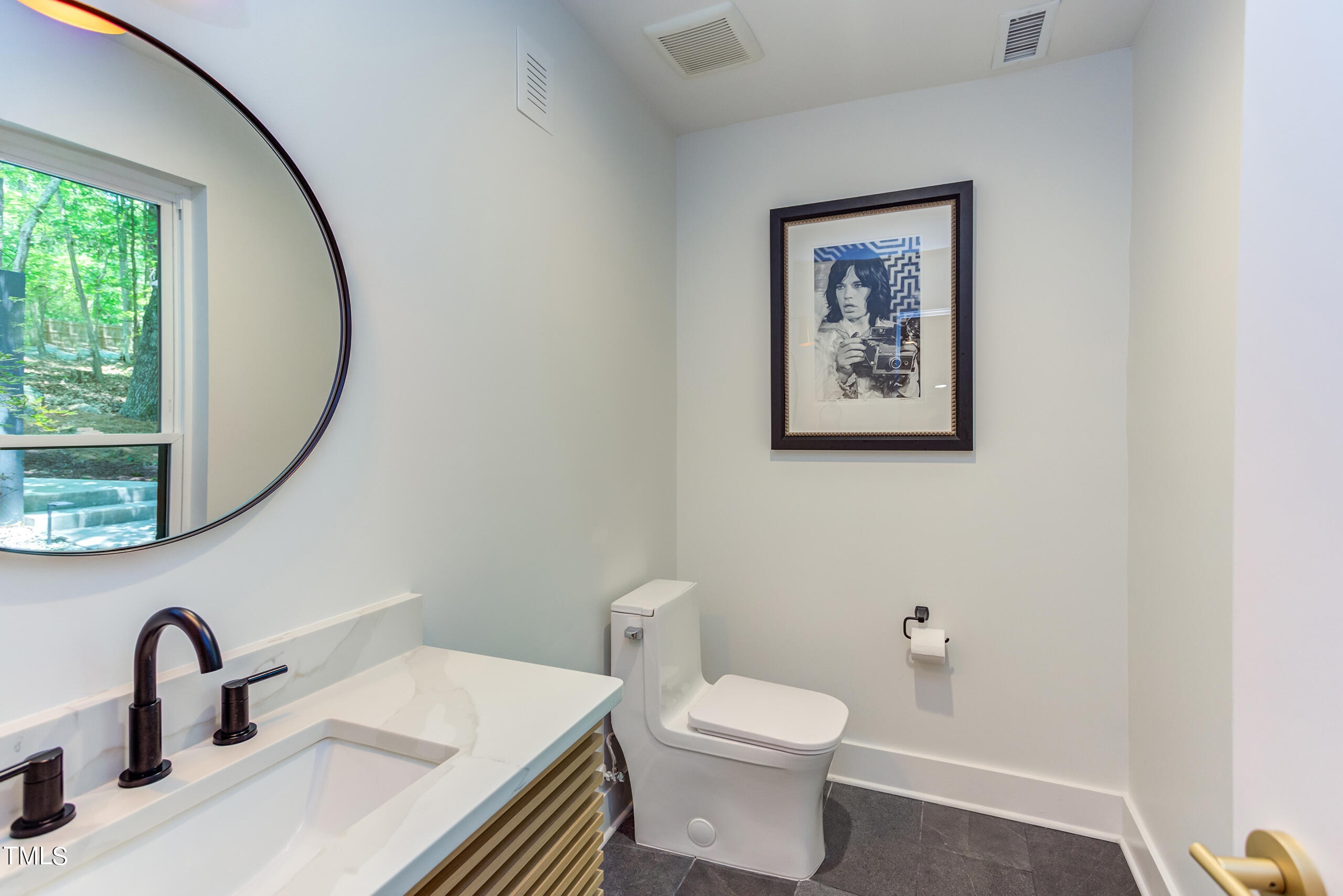 2008 Ridgewood Road Chapel Hill, NC 27516 - Photo 23 of 73 a bathroom with a toilet a sink and a mirror