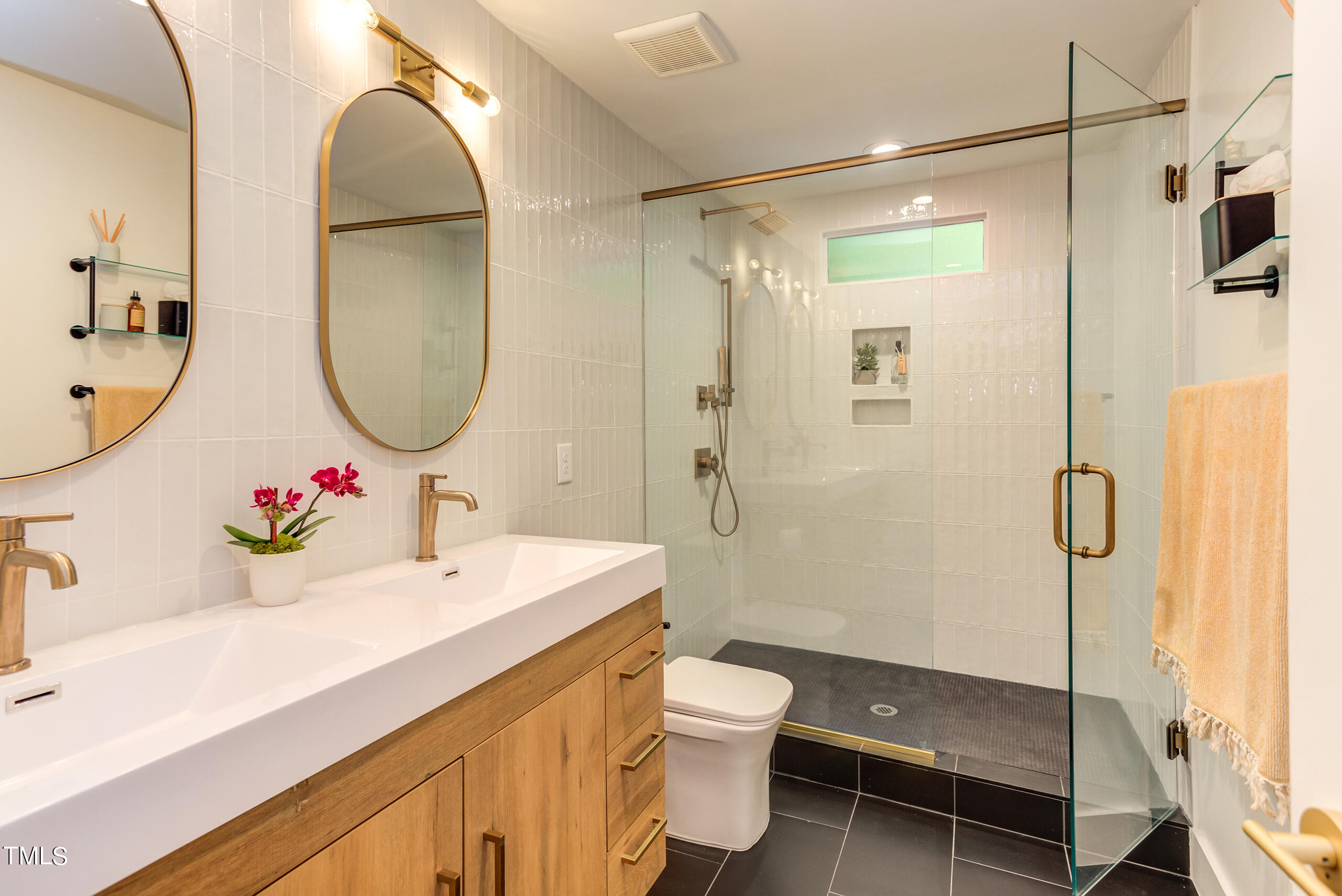 2008 Ridgewood Road Chapel Hill, NC 27516 - Photo 25 of 73 a bathroom with a sink mirror toilet and shower