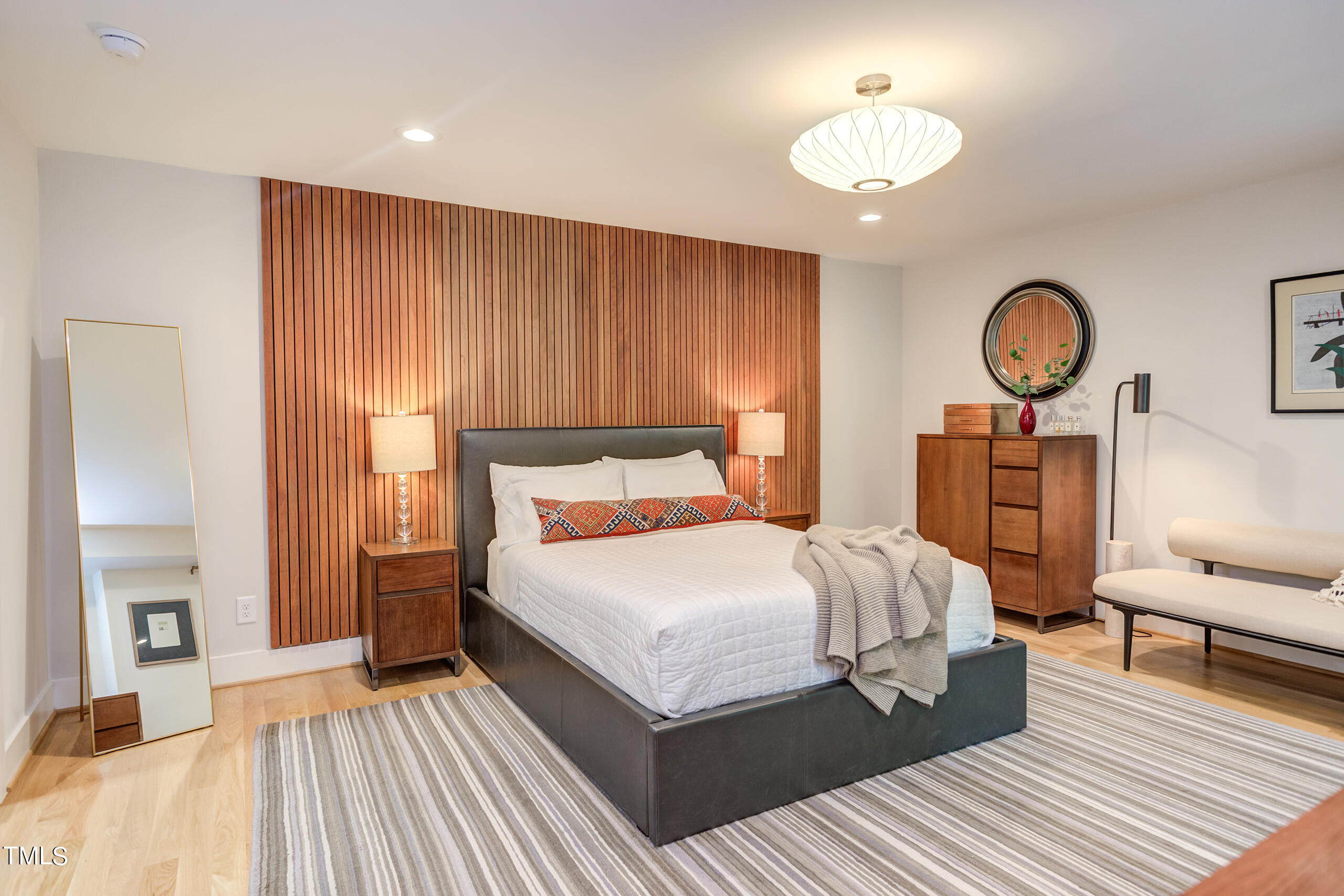 2008 Ridgewood Road Chapel Hill, NC 27516 - Photo 28 of 73 a bedroom with a bed and a chandelier