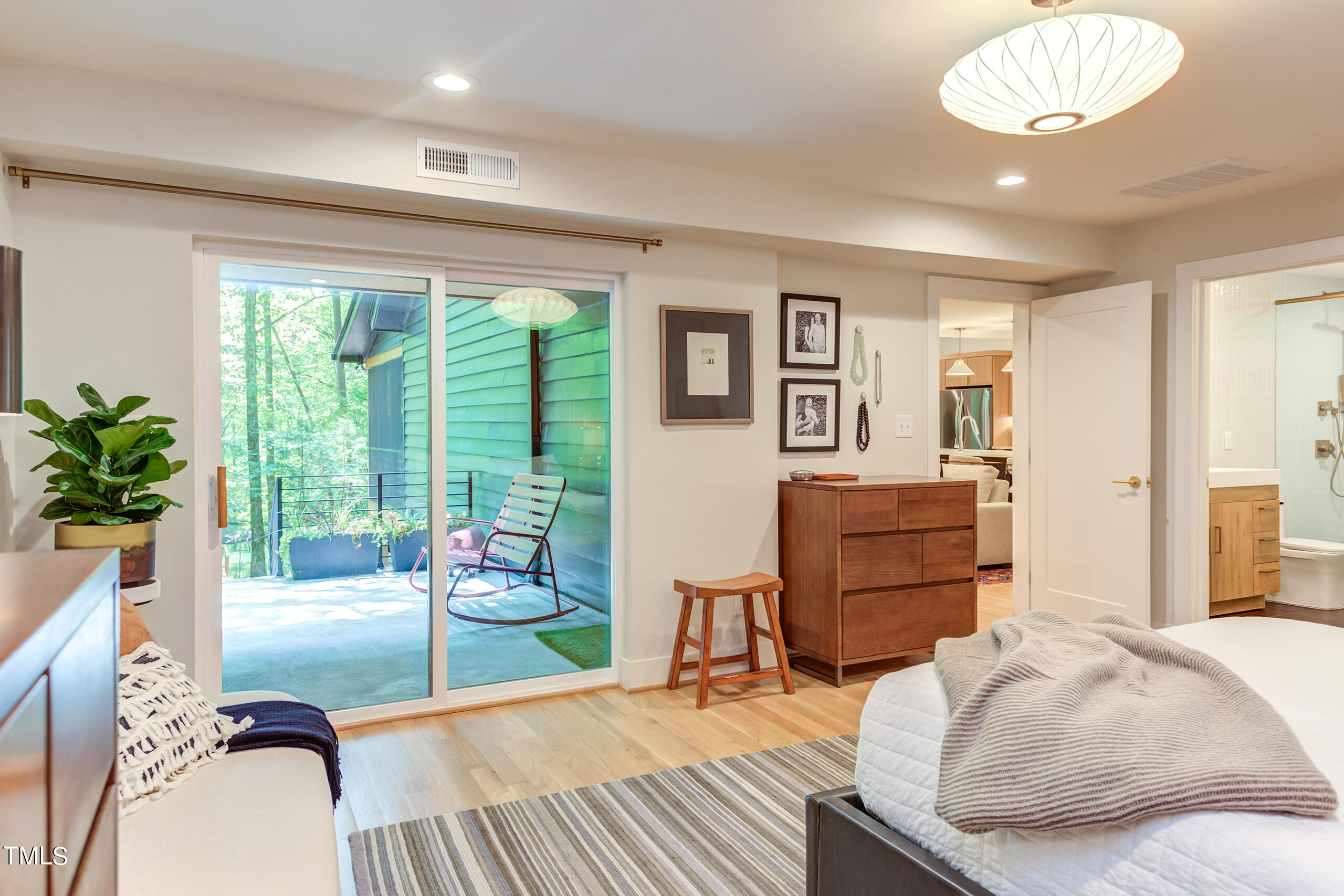 2008 Ridgewood Road Chapel Hill, NC 27516 - Photo 31 of 73 a bedroom with a bed and wooden floor