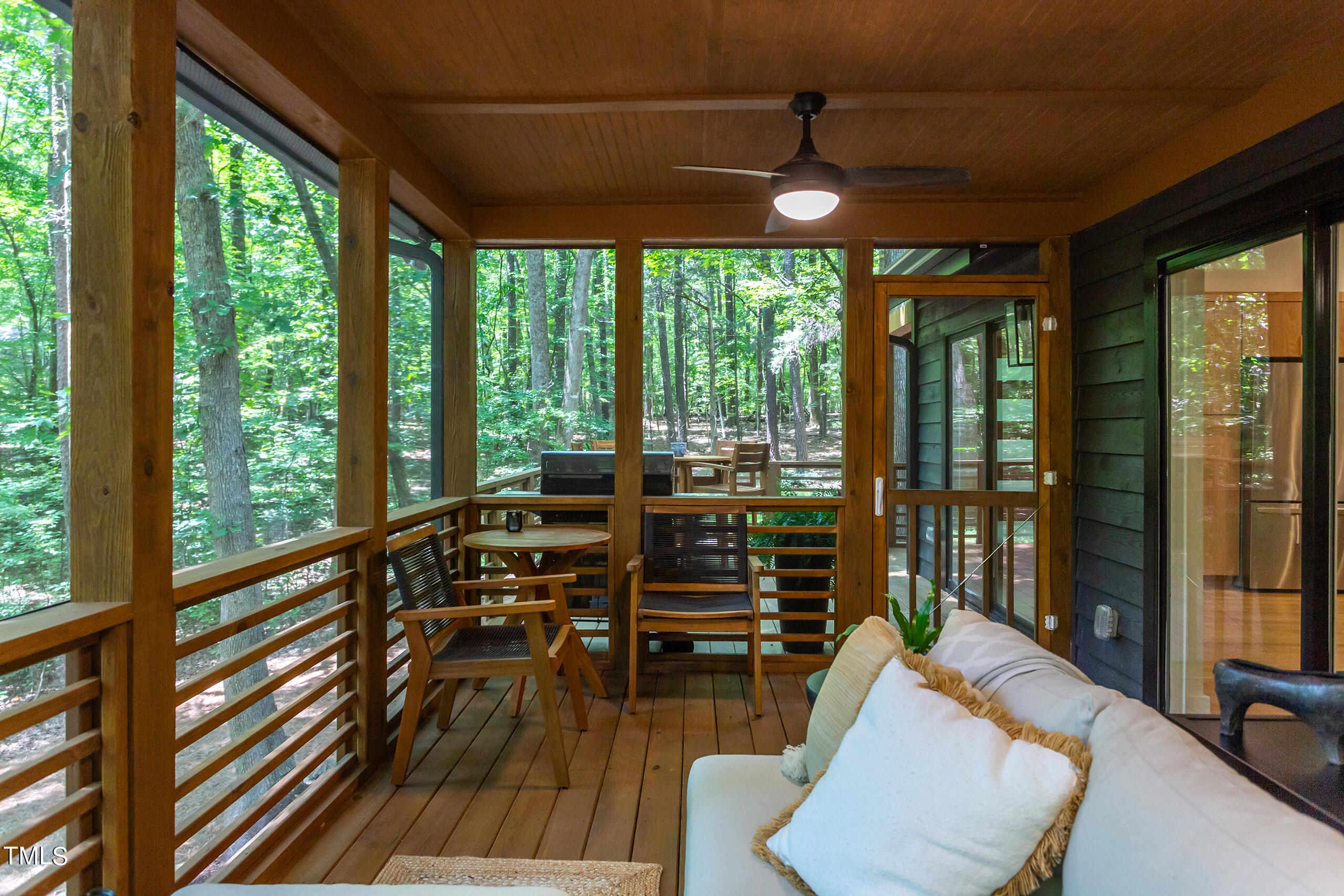 2008 Ridgewood Road Chapel Hill, NC 27516 - Photo 53 of 73 a view of a living room with furniture and floor to ceiling windows