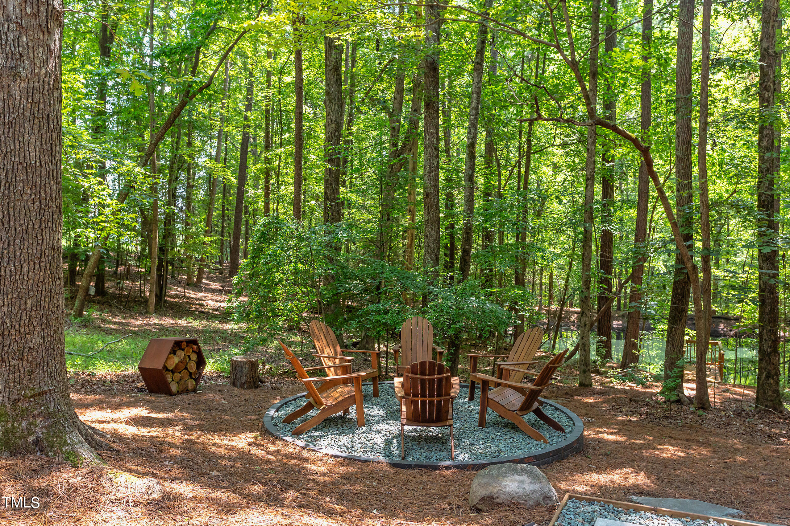 2008 Ridgewood Road Chapel Hill, NC 27516 - Photo 61 of 73 a view of a patio with table and chairs and potted plants