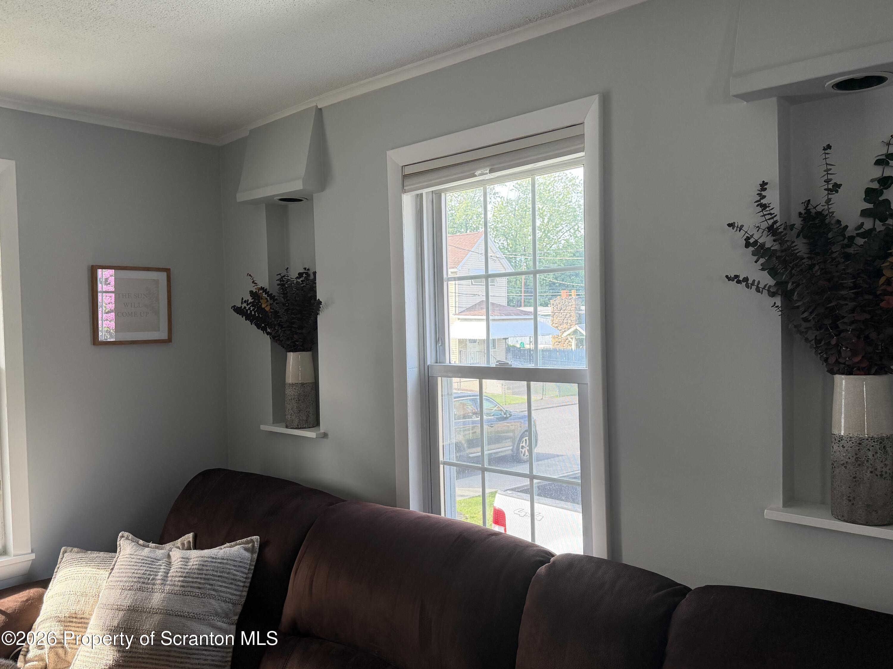 320 Haverly Street Throop, PA 18512 - Photo 14 of 27 a bedroom with a bed and a window