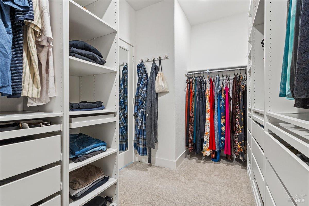 1469 Oak Circle Rohnert Park, CA 94928 - Photo 24 of 42 Boutique-Style Organization The professionally designed walk-in closet offers extensive shelving, drawers, hanging space, and built-in organizational systems to maximize both beauty and functionality.