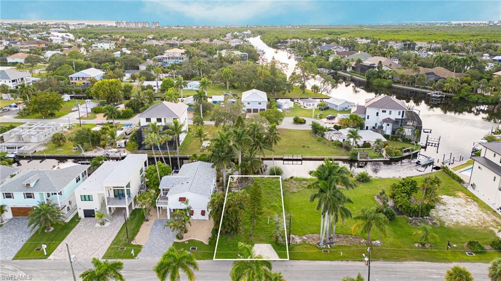 27563 Big Bend Road Bonita Springs, FL 34134 - Photo 3 of 10 an aerial view of residential houses with outdoor space and swimming pool