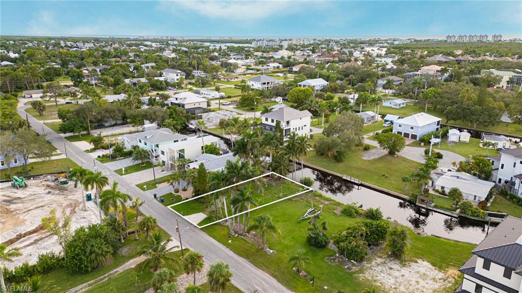 27563 Big Bend Road Bonita Springs, FL 34134 - Photo 4 of 10 an aerial view of residential houses with outdoor space