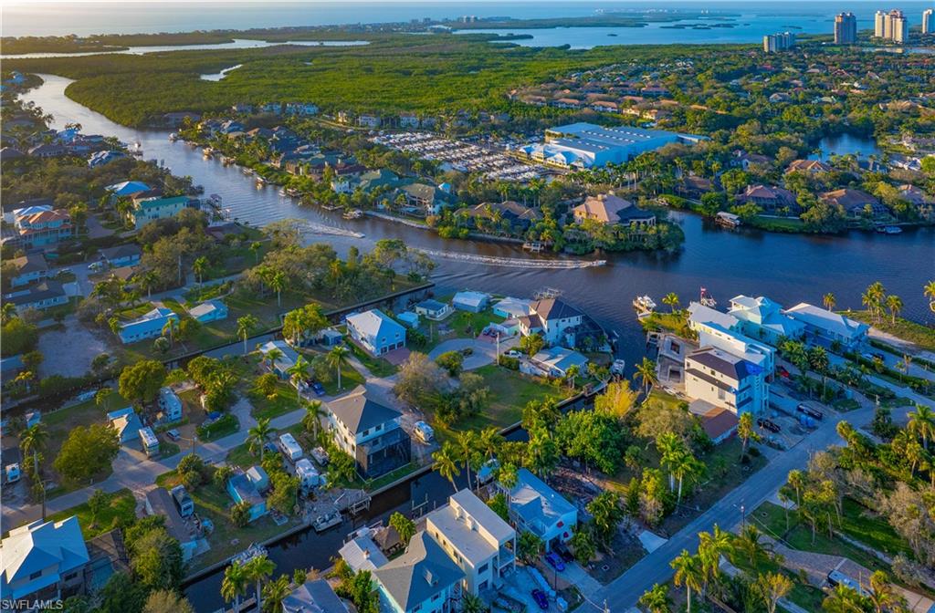 27563 Big Bend Road Bonita Springs, FL 34134 - Photo 5 of 10 a view of a lake with a building in the background