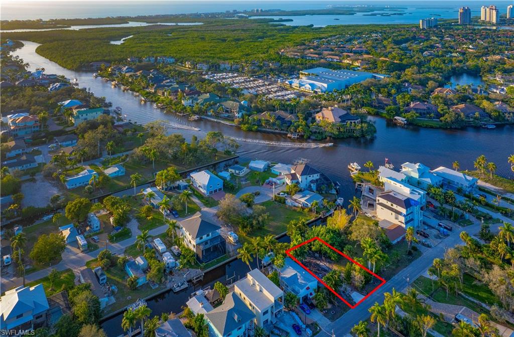 27563 Big Bend Road Bonita Springs, FL 34134 - Photo 7 of 10 a view of a lake with a flower garden