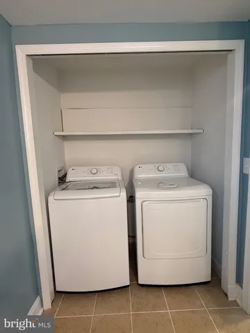 a view of balcony with wooden floor and fence