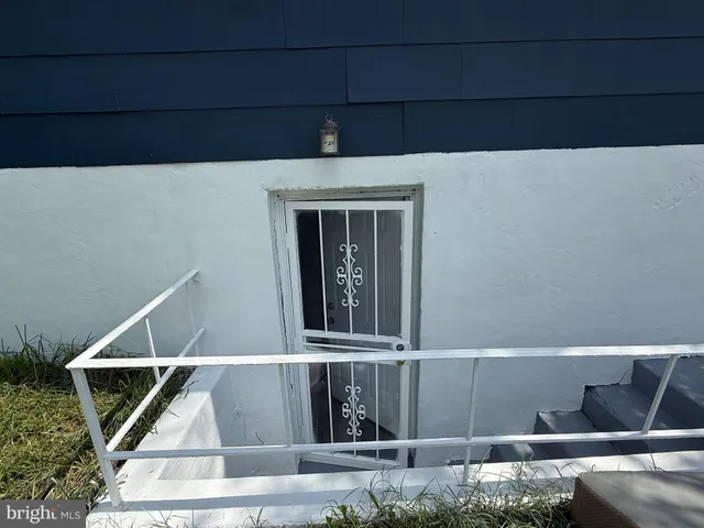 a view of a balcony with floor to ceiling windows with wooden floor