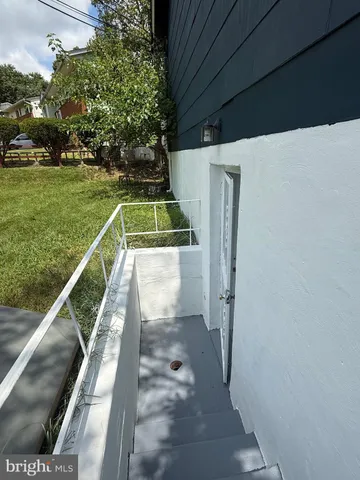 a view of a house with pool and a yard