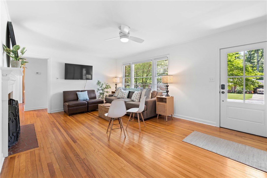 207 Brook Street Clemson, SC 29631 - Photo 7 of 39 Hardwood floors and generous windows illuminate this inviting and versatile living area.