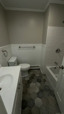 a bathroom with a sink and a toilet