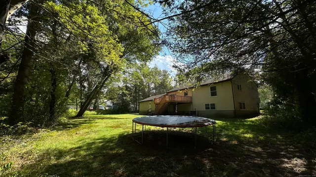 a backyard of a house with lots of green space