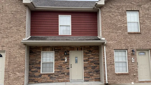 a view of a kitchen with a sink and a refrigerator