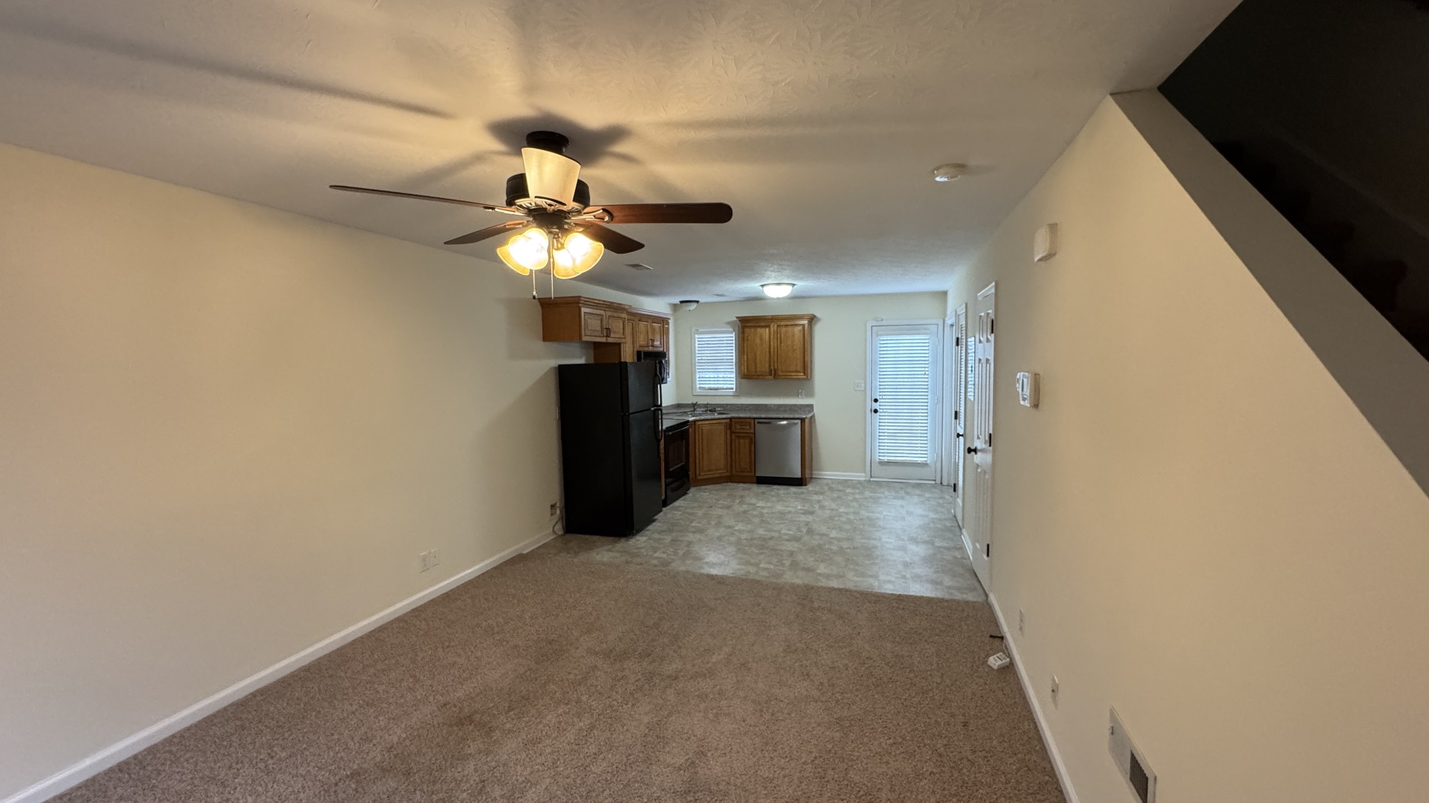 895 Branch Road Clarksville, TN 37043 - Photo 2 of 11 a view of a kitchen with a sink and a refrigerator