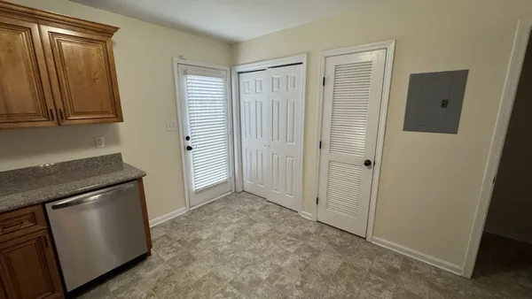 a view of empty room with a fireplace