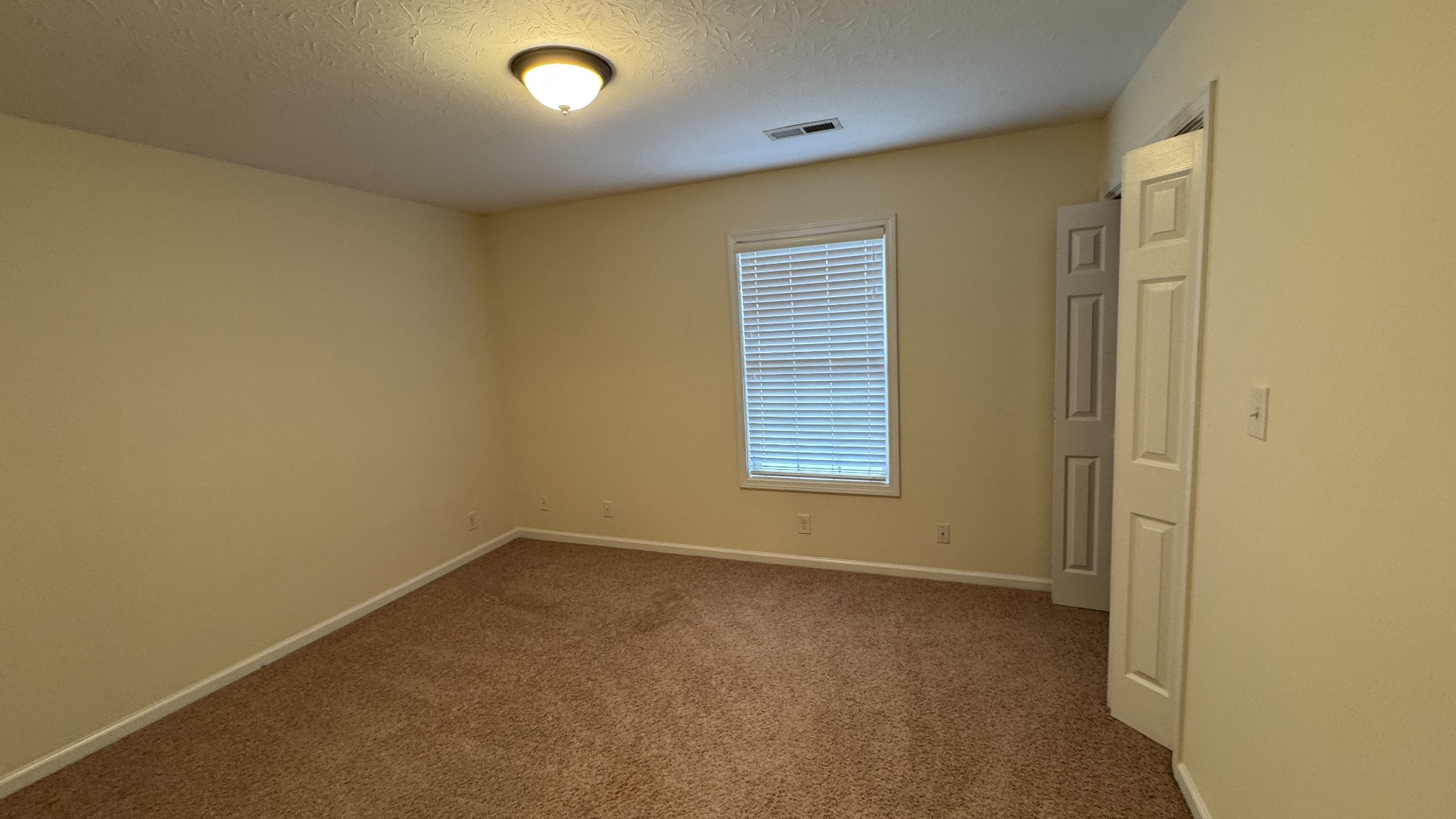 895 Branch Road Clarksville, TN 37043 - Photo 9 of 11 an empty room with a empty space and a window