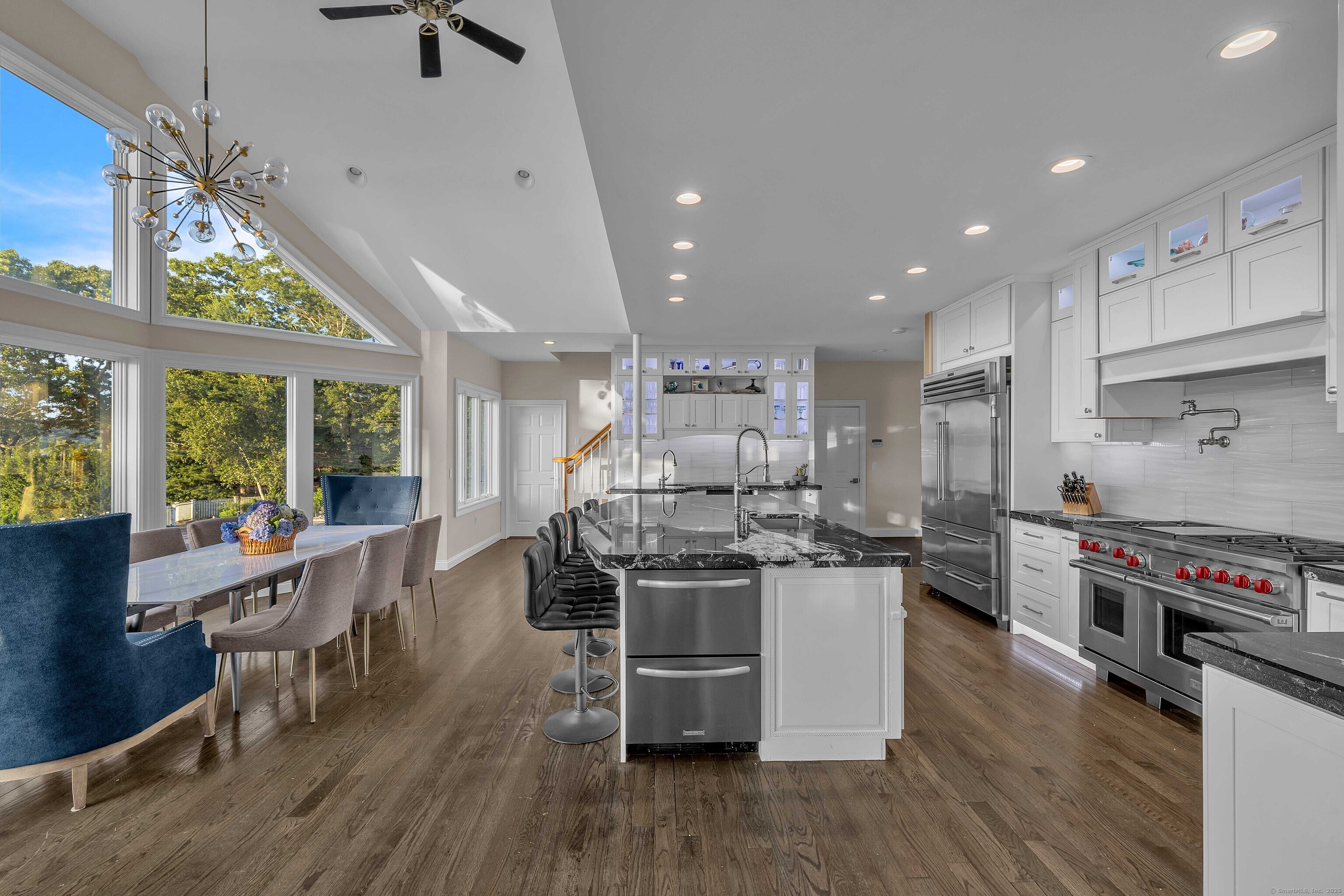 12 Rocky Point Road Old Saybrook, CT 06475 - Photo 9 of 28 a kitchen with stainless steel appliances a stove a sink a refrigerator and wooden floor