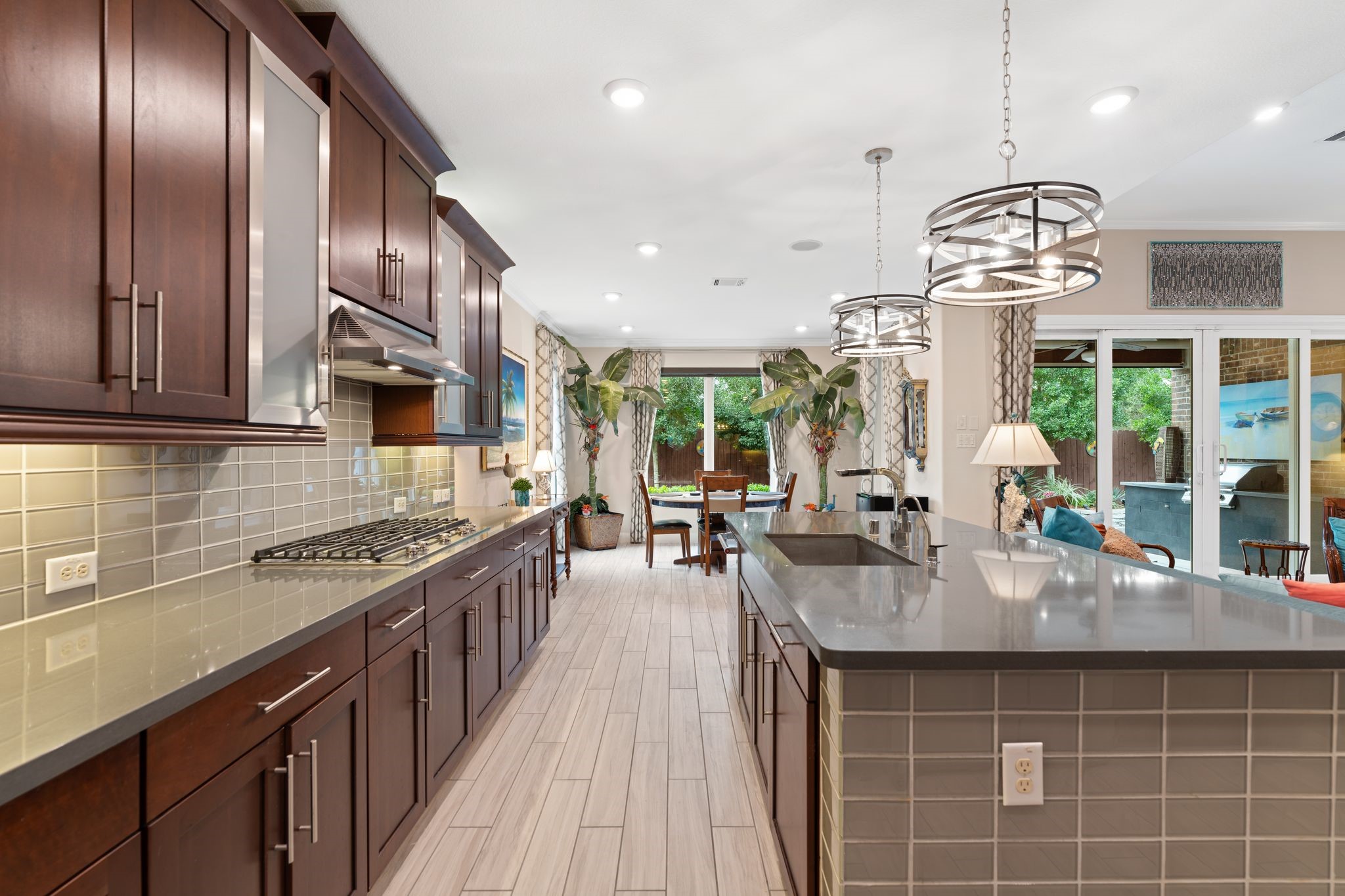 51 Scepter Ridge Sugar Land, TX 77498 - Photo 22 of 50 a kitchen with stainless steel appliances granite countertop a sink a stove and a wooden floors