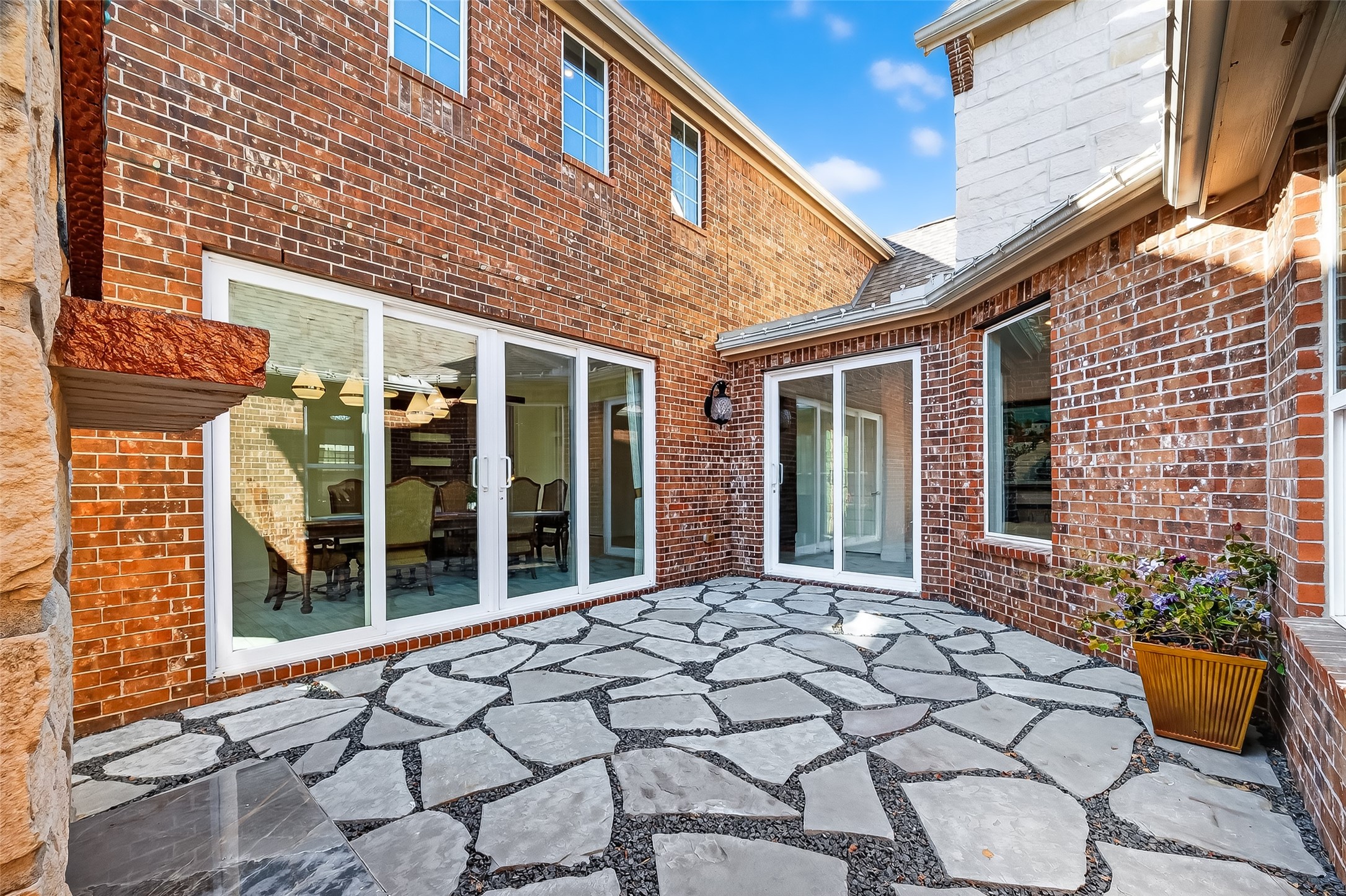 51 Scepter Ridge Sugar Land, TX 77498 - Photo 24 of 48 The fireplace nook provides a unique outdoor space just off the home. It feels private and intimate, perfect for relaxing after a long day.