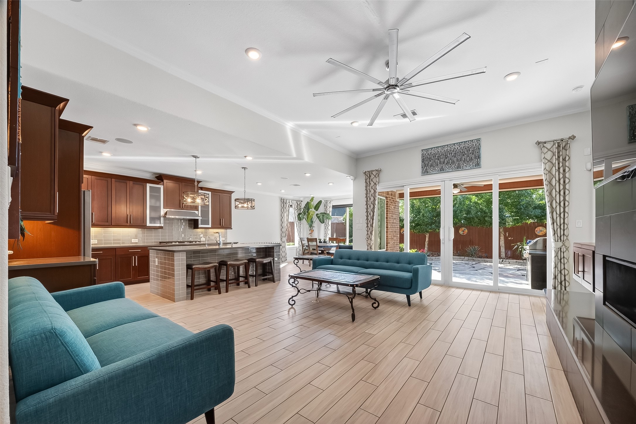 51 Scepter Ridge Sugar Land, TX 77498 - Photo 25 of 48 The family room opens wide with plenty of seating space and strong natural light. Picture movie nights, game days, or quiet evenings spent relaxing. This home is immaculately maintained throughout!