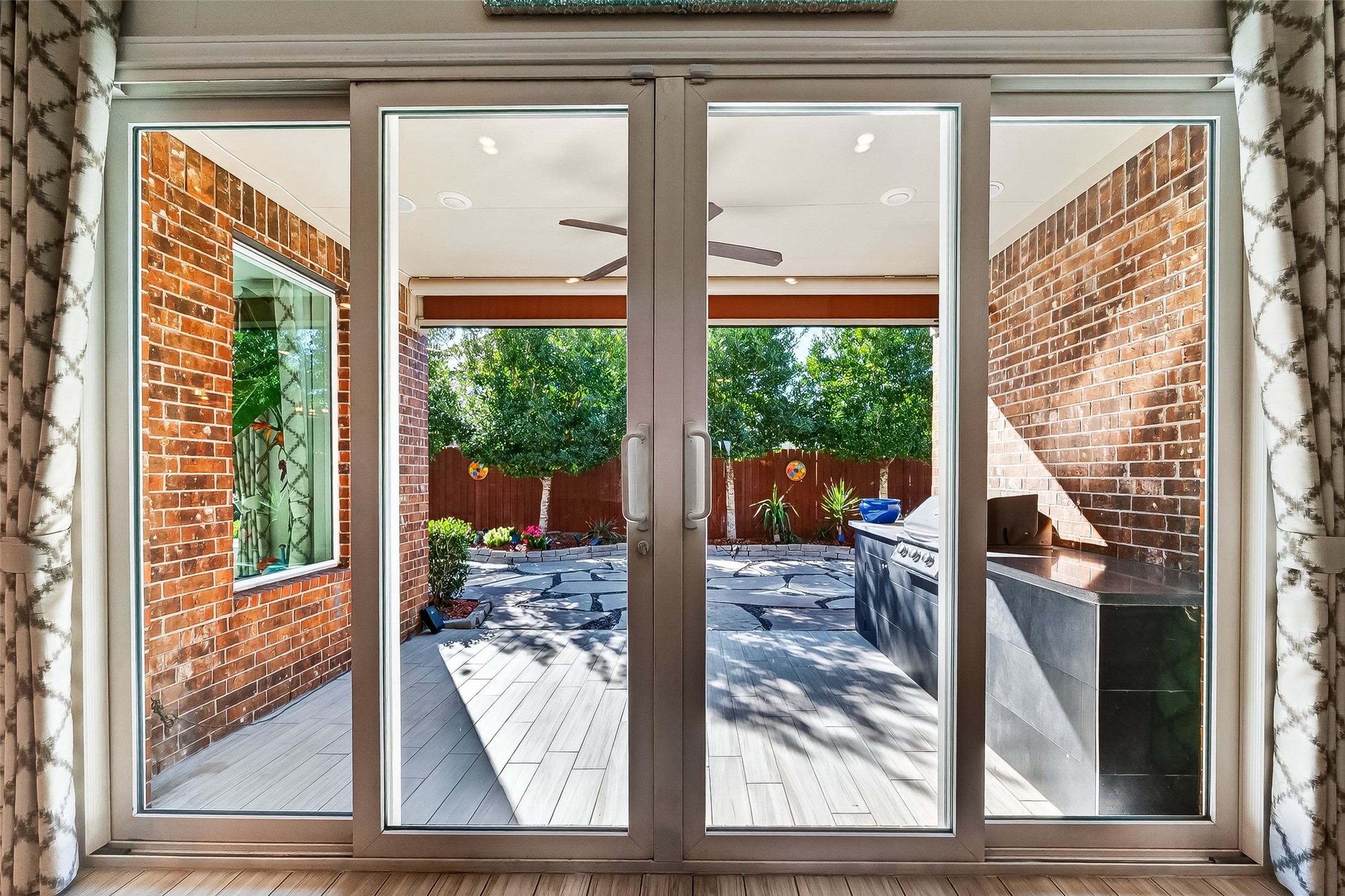 51 Scepter Ridge Sugar Land, TX 77498 - Photo 28 of 48 From outside, the rear of the home showcases the covered patio and comfortable outdoor seating areas. Picture weekend gatherings or quiet evenings under the roofline.