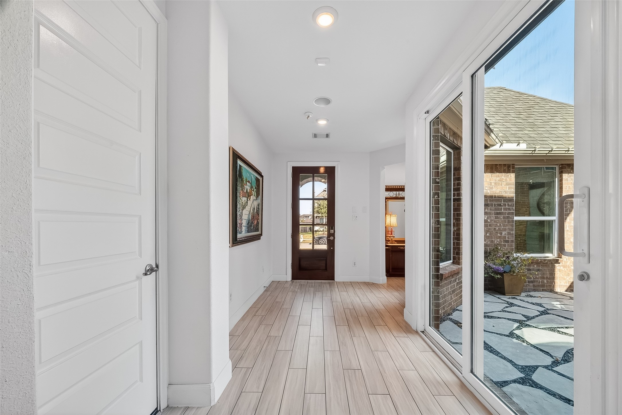 51 Scepter Ridge Sugar Land, TX 77498 - Photo 3 of 50 a view of a hallway with wooden floor and a living room