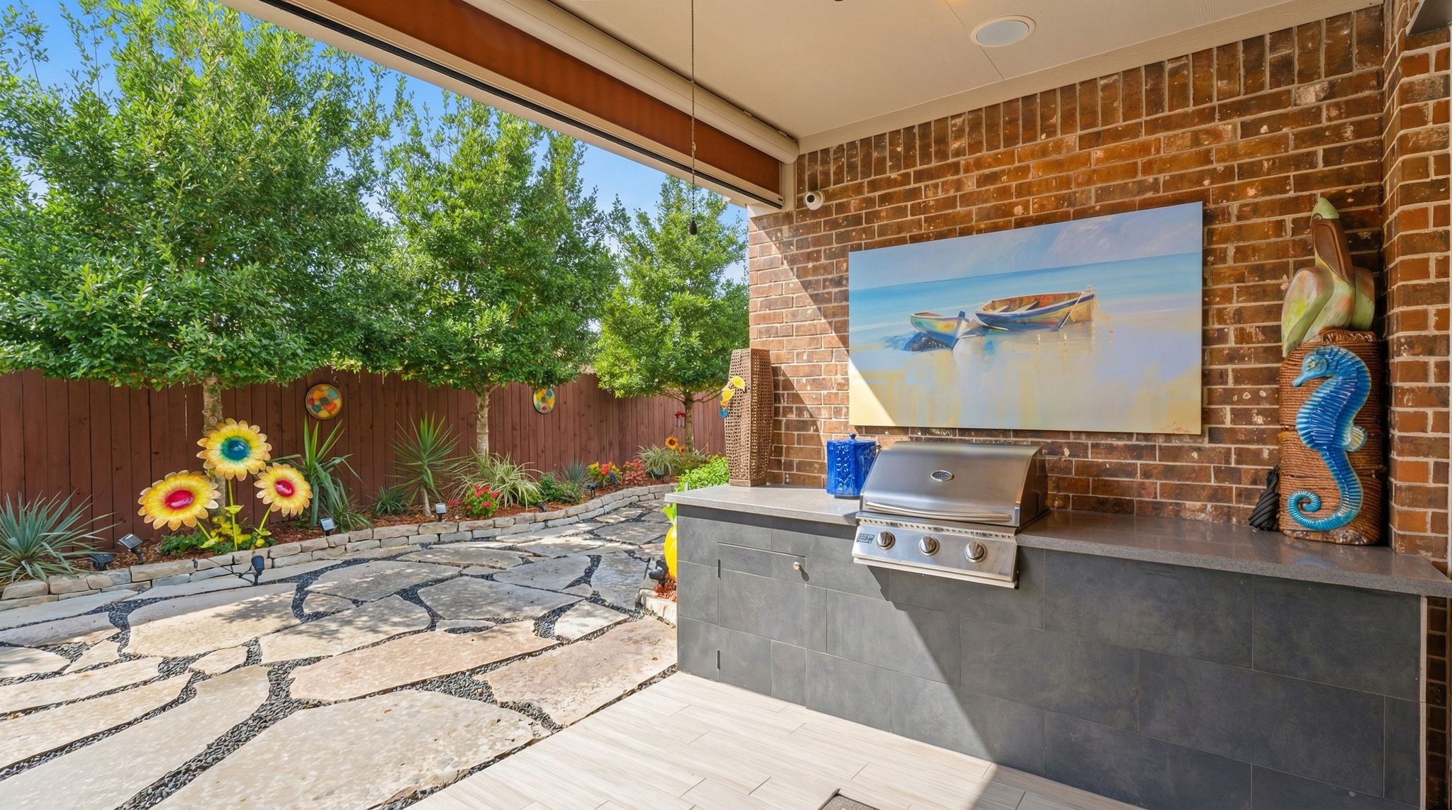 51 Scepter Ridge Sugar Land, TX 77498 - Photo 3 of 48 The outdoor kitchen and patio area highlight the backyard setting. Imagine weekend cookouts, friends visiting, morning coffee and a newspaper and evenings spent enjoying the space. You will feel like you are on vacation without ever leaving your home!