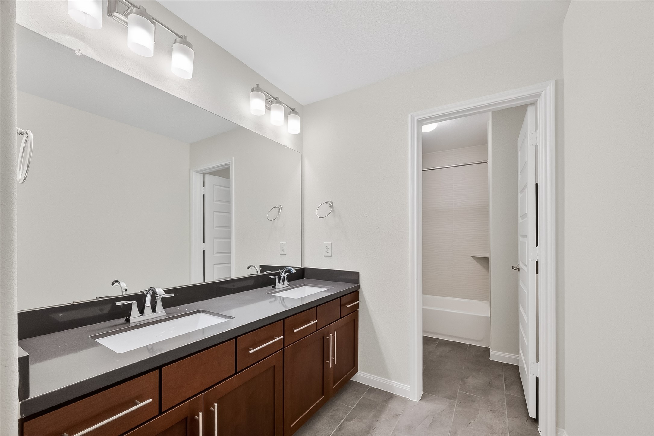 51 Scepter Ridge Sugar Land, TX 77498 - Photo 36 of 48 The secondary bath upstairs offers a clean, functional layout with modern fixtures and practical storage.
