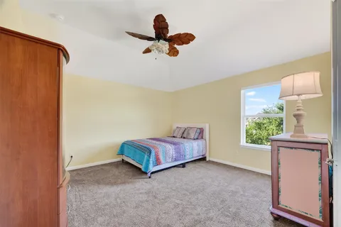 a living room with a bed furniture and a window