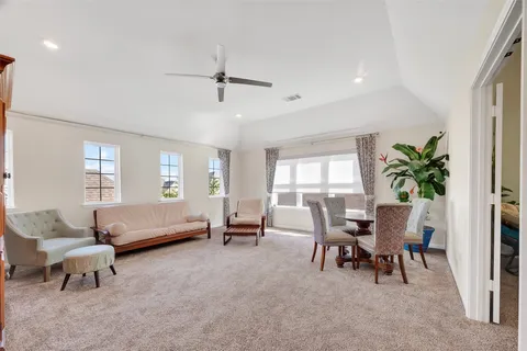 a dining room with furniture and window