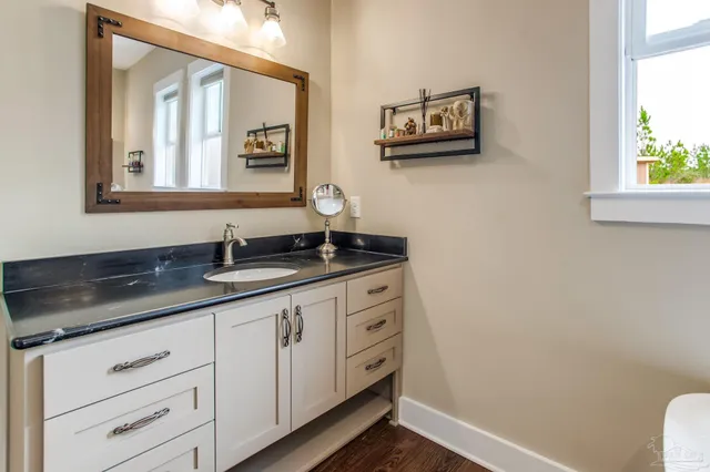 a bathroom with a sink and a mirror