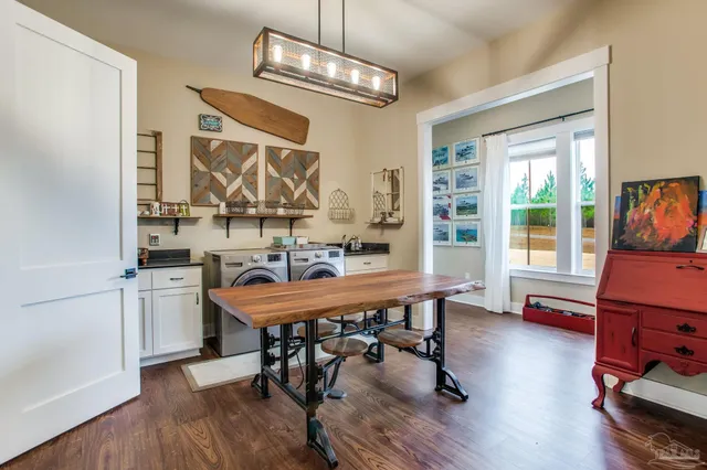 a view of a dining room with furniture window and wooden floor