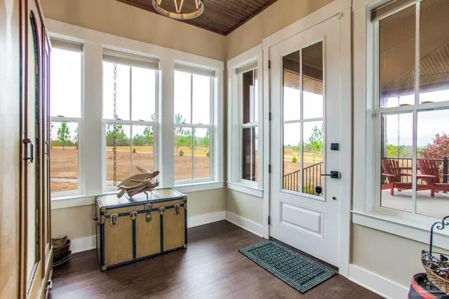 a view of workspace with wooden floor and windows