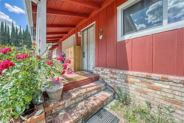 a view of a house with a flower garden