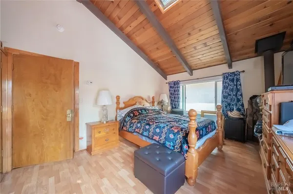 a living room with furniture fireplace and flat screen tv