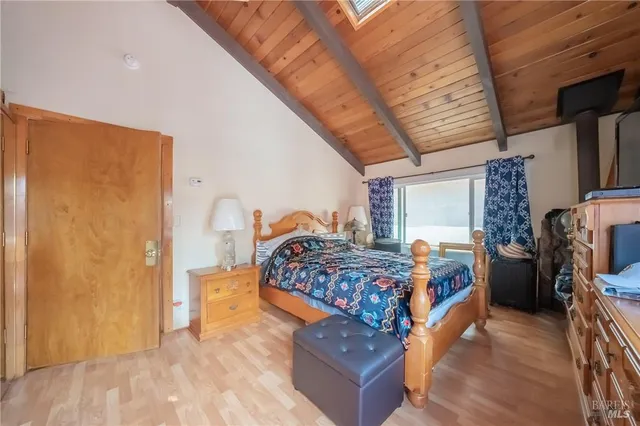a living room with furniture fireplace and flat screen tv