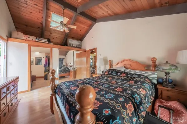 a bed sitting in a bedroom next to a window