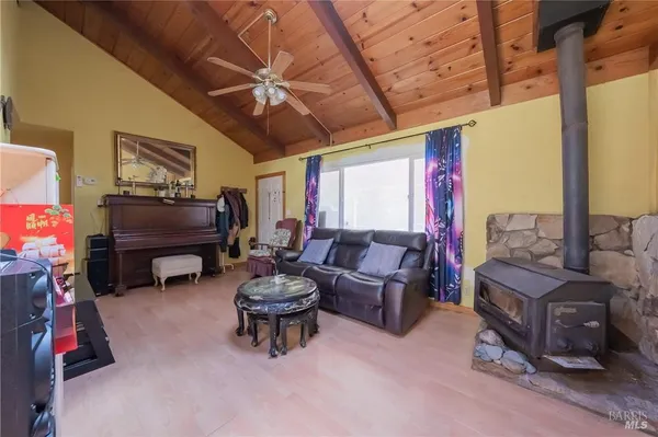 a living room with furniture and a gym equipment