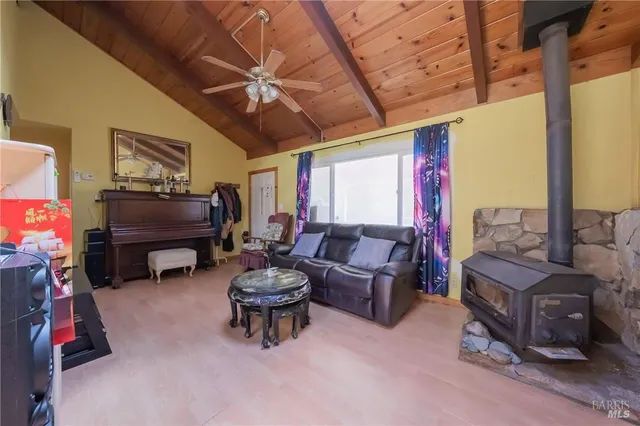 a living room with furniture and a gym equipment