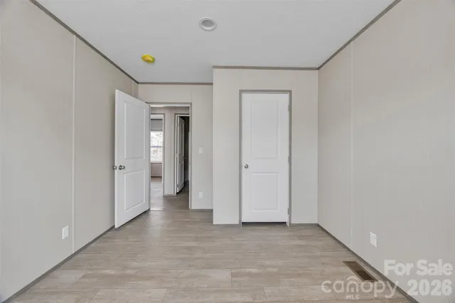 a spacious bathroom with a granite countertop sink a toilet and a shower