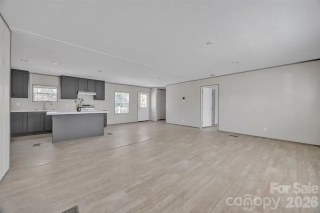 a view of a storage & utility room with a sink