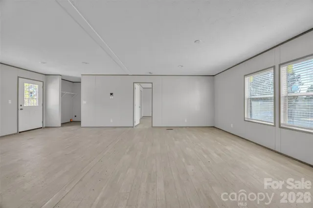 a kitchen with kitchen island granite countertop a sink stove top oven and cabinets